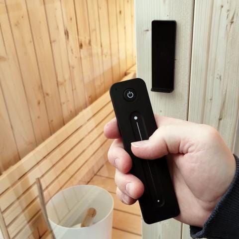 SaunaLife Model X7 Home Sauna Remote in Hand